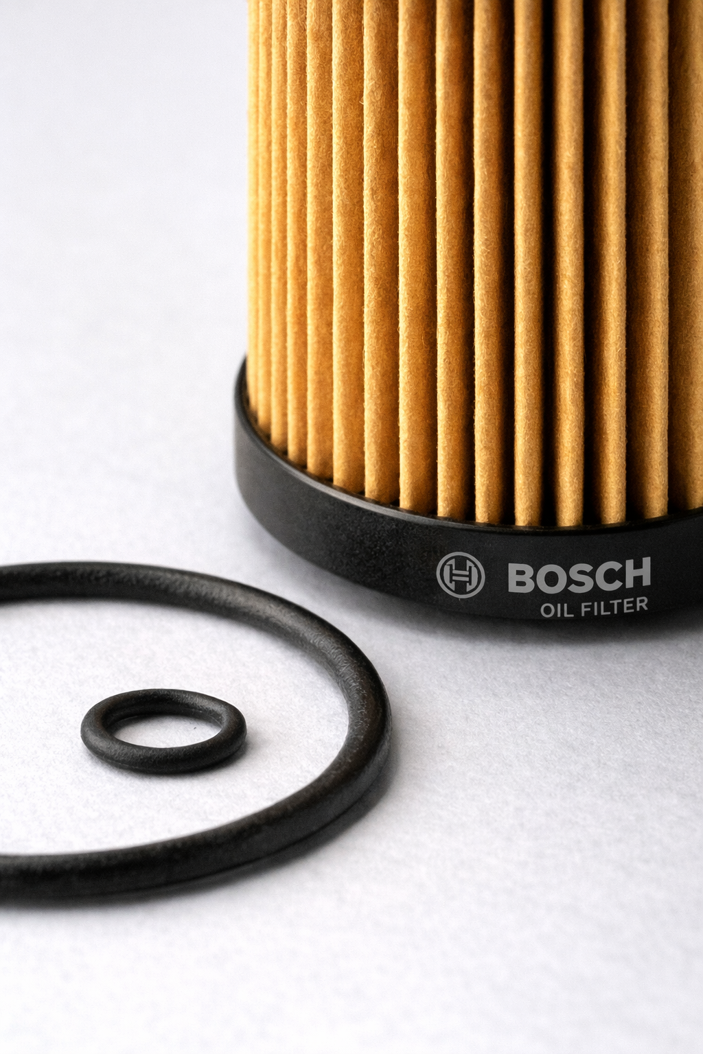 Close-up of Bosch oil filter P7157 with O-ring, available at Dub Source Limited in Kingston, Jamaica, for Volkswagen and Audi vehicles.