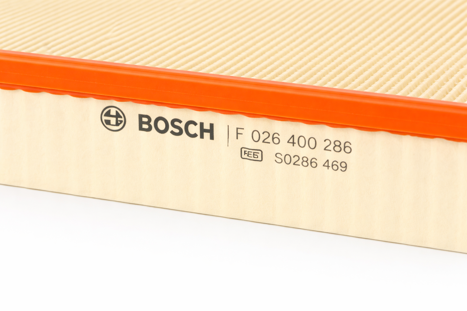A close-up view of the side of the air filter, clearly displaying the BOSCH logo and part numbers F 026 400 286 and S0286 469 printed on the cream-colored housing.