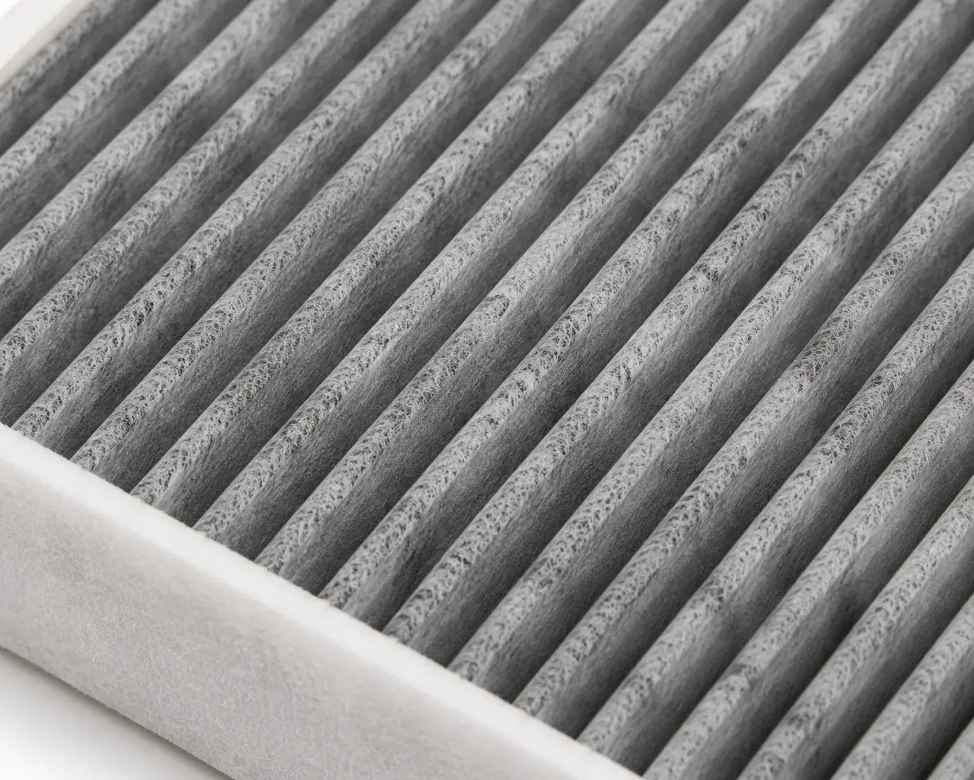 Close-up view of Bosch R2369 activated carbon cabin filter pleated media texture
